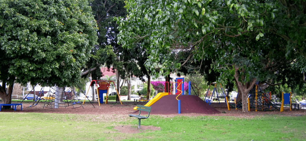 A small playground with trees at Jubilee Park