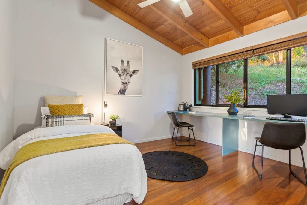 A beautiful pristine Brisbane bedroom with wooden floors