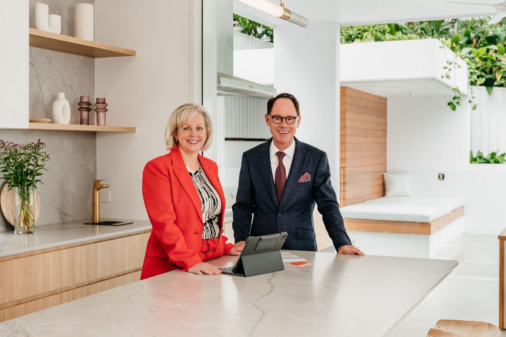 Christina and Grant Penrose standing in a kitchen