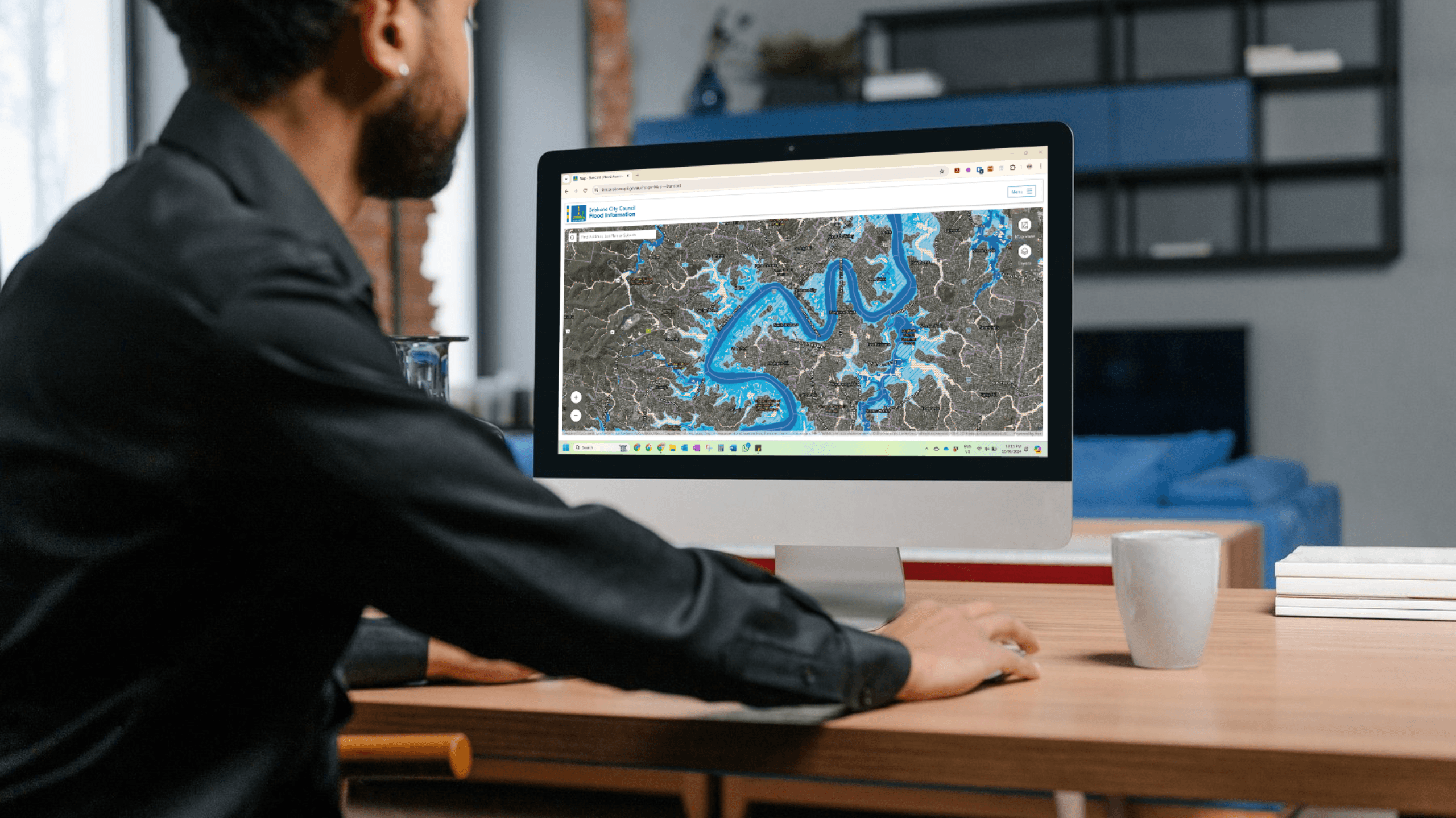 Man looking at flood map on his computer