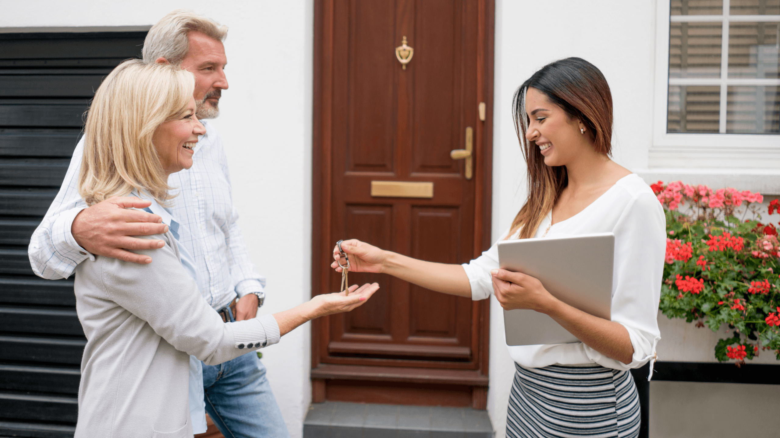 Real estate agent with property buyers